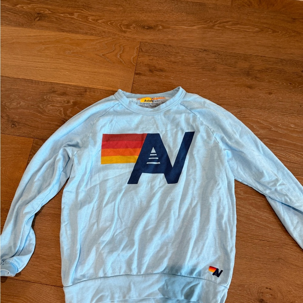 Aviator Nation Light Blue Crewneck Sweater with Multicolor Logo